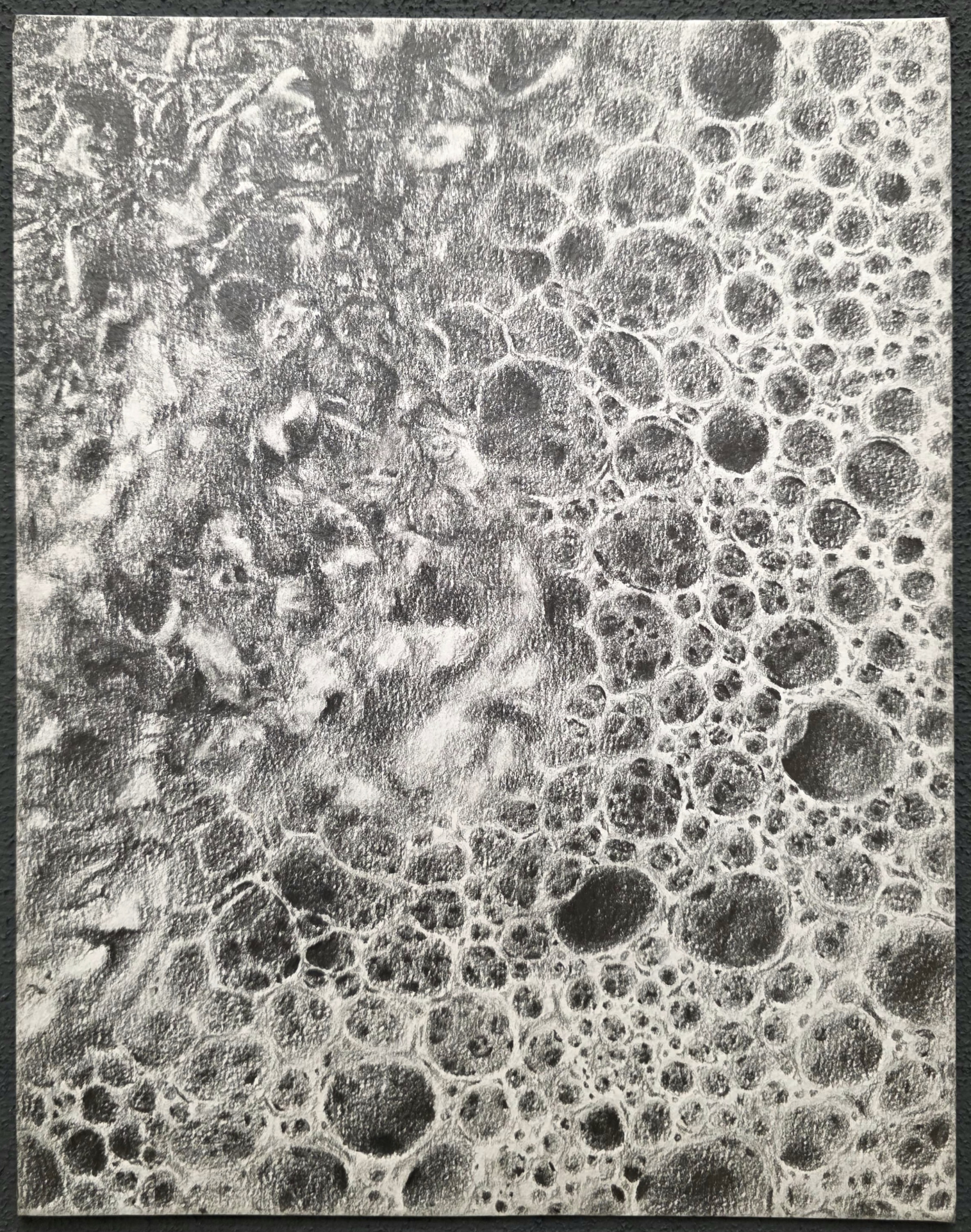 Monochrome drawing of dense bubbling textures spreading diagonally across the surface.